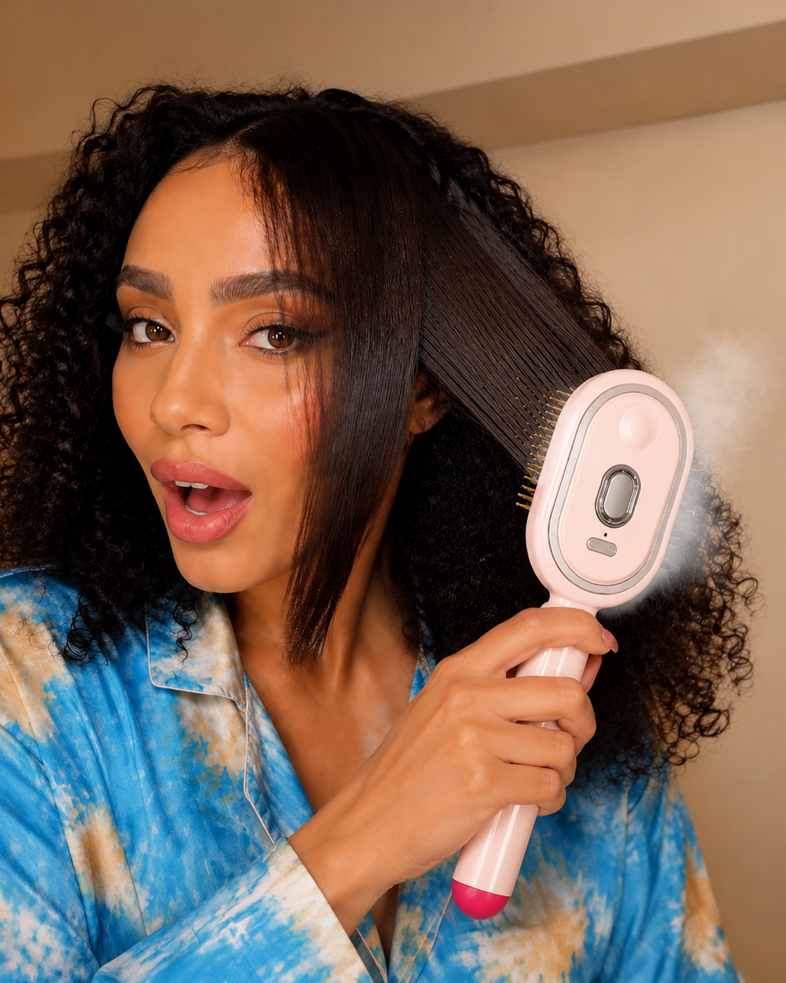 Woman using VapourSilk™ Steam Brush on natural curly hair